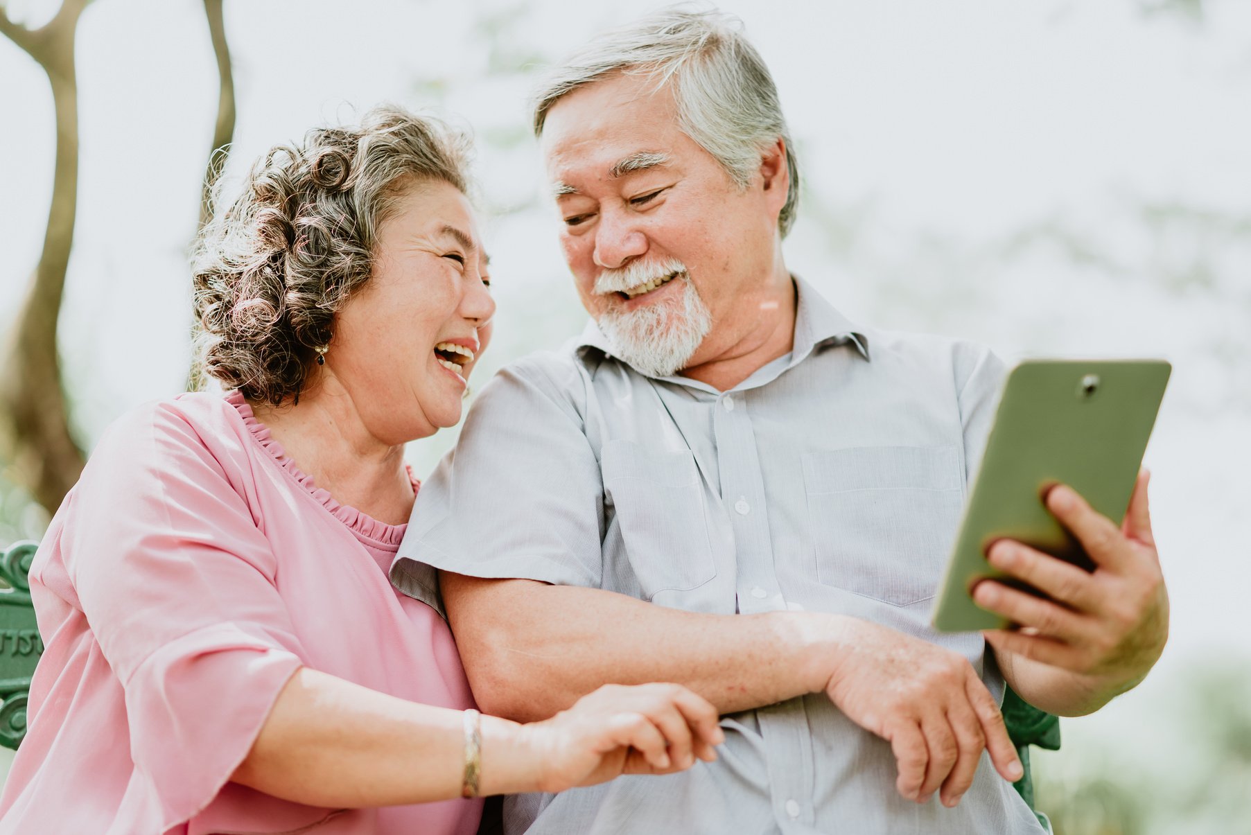 Happy Senior Couple Using Their Tablet  